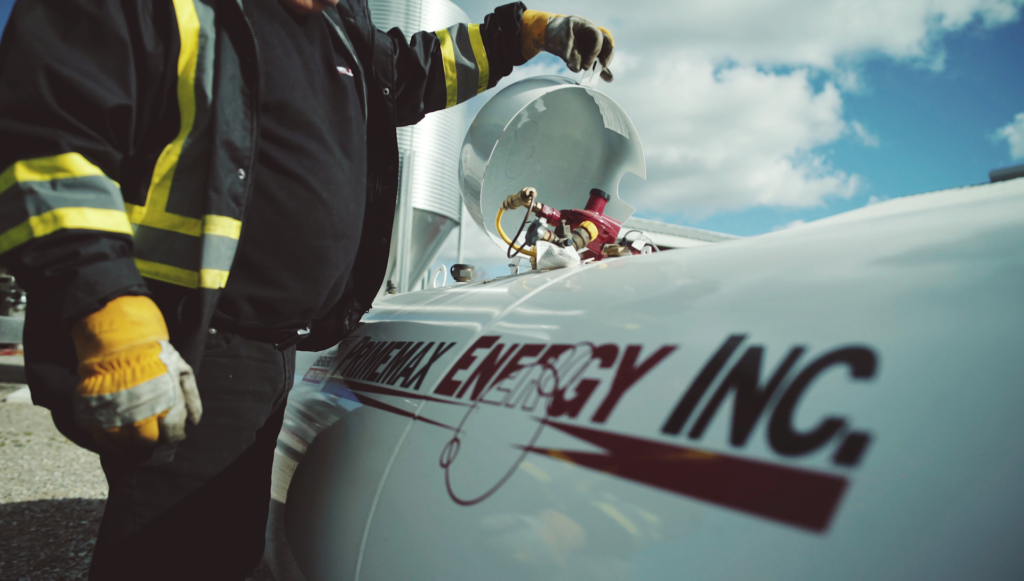 A Primemax Energy Employee opening a propane tank. A Primemax Energy Employee opening a propane tank.
